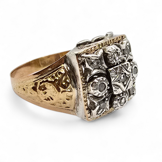 Sortija bicolor en oro de 18k, plata y diamantes.